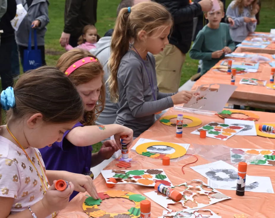 a group of children painting