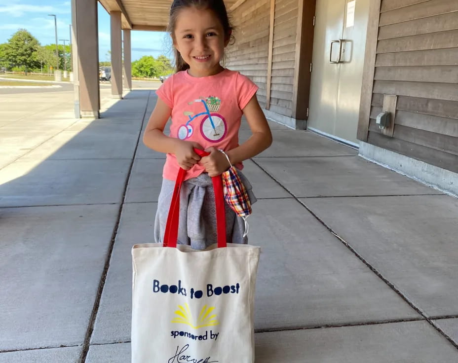 a girl holding a bag