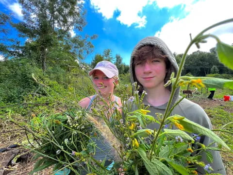 a couple of people in a garden