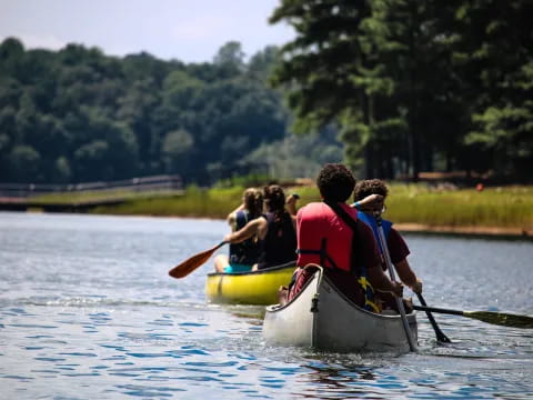 a group of people in a canoe