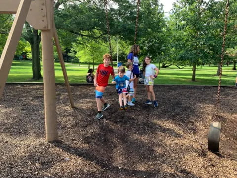 a group of kids on swings