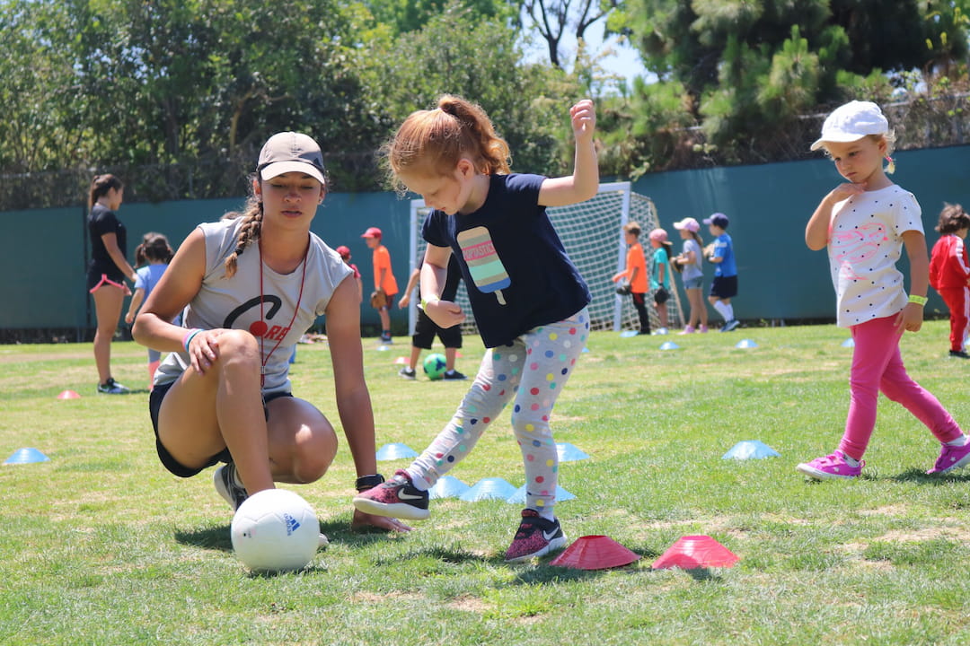 a group of kids playing football