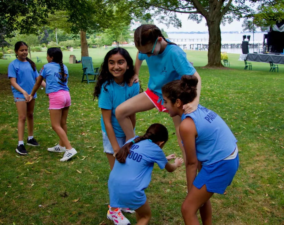 a group of people in blue shirts