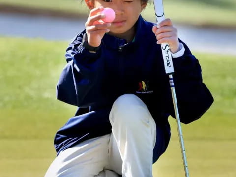a boy playing golf