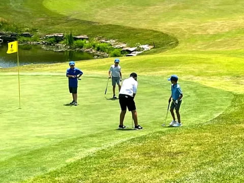 a group of people playing golf