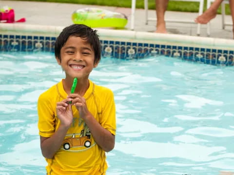 a boy in a yellow shirt