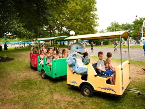 kids riding in a toy train