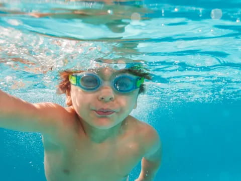 a child swimming in a pool