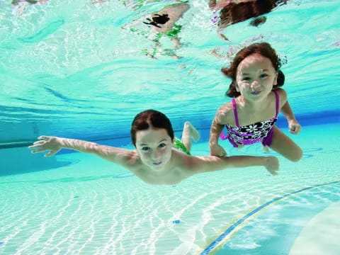 a man and woman in a pool