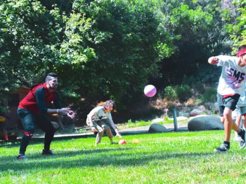 a group of people playing frisbee