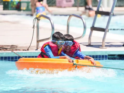 a boy in a pool