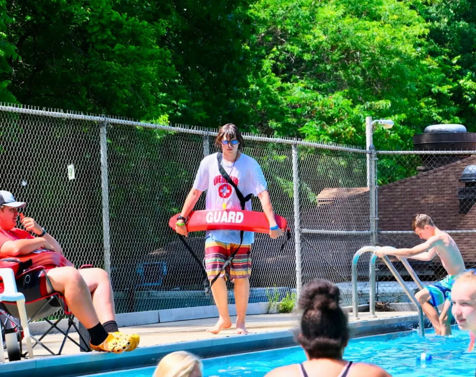 a person standing on a pool