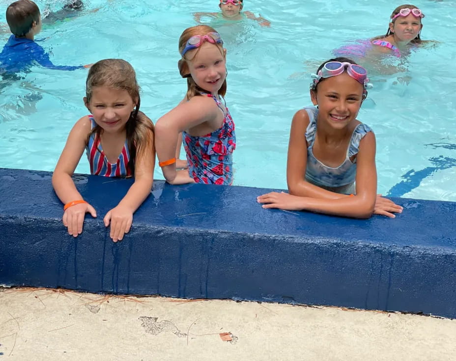 a group of girls in a pool