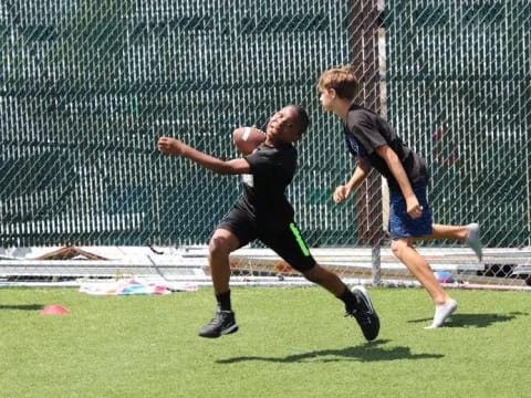 a couple of men playing football
