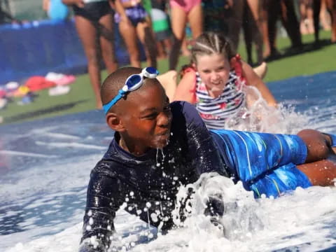 a person and a child in a pool
