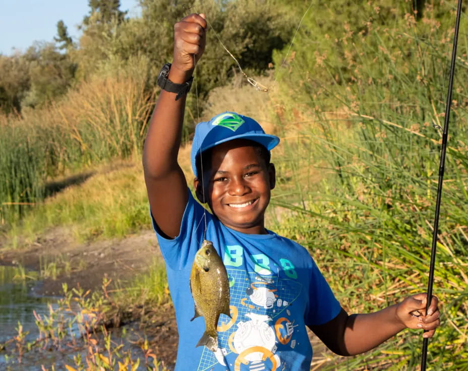 a person holding a fish