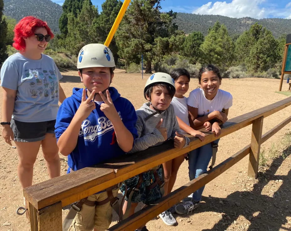 a group of kids posing for a photo