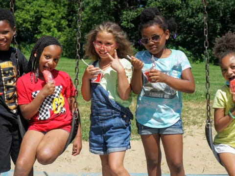 a group of children on swings