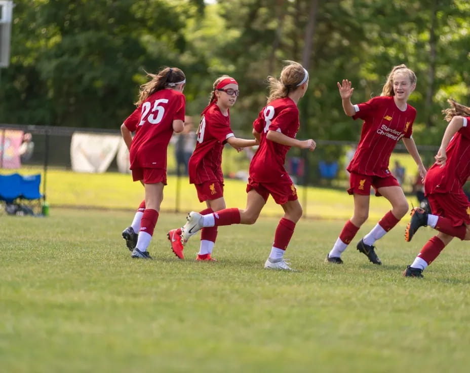 a group of girls playing football