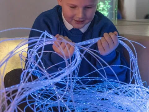 a boy playing with a basket