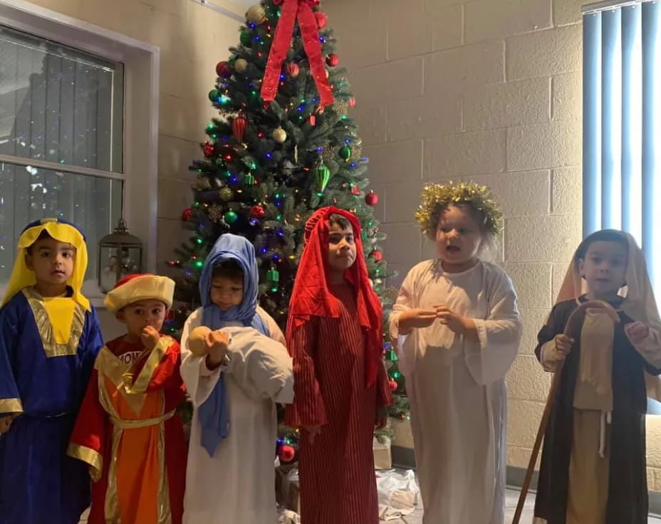 a group of children in clothing