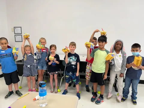 a group of kids holding toys