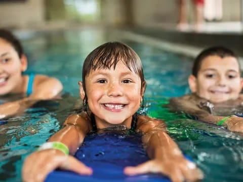 a group of children in a pool