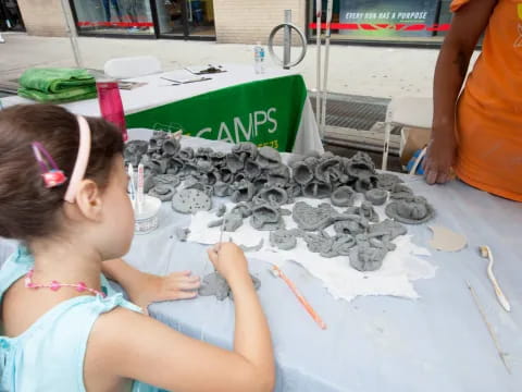a girl painting on a table