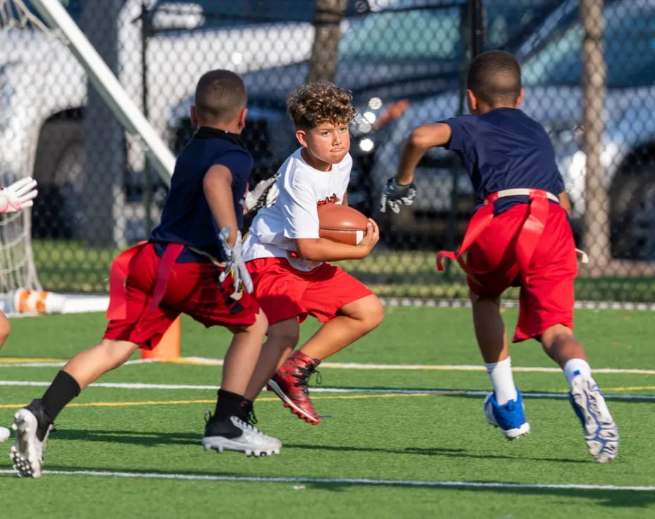 a group of boys playing football