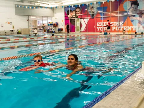 a man and woman in a pool