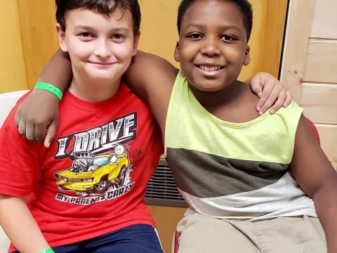 two boys sitting on the floor