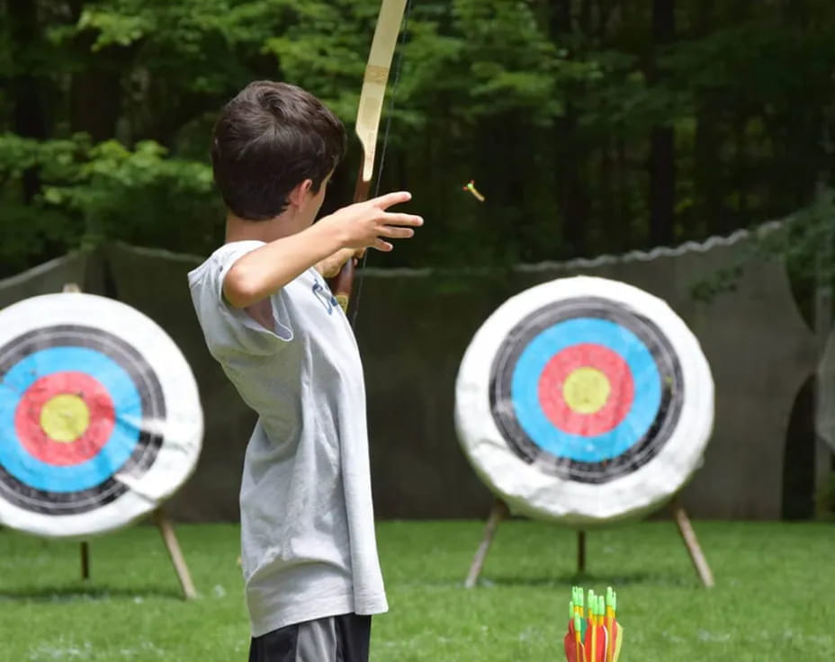 a boy shooting a target
