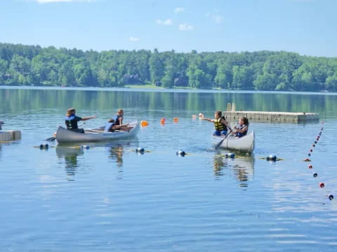 people in boats on water