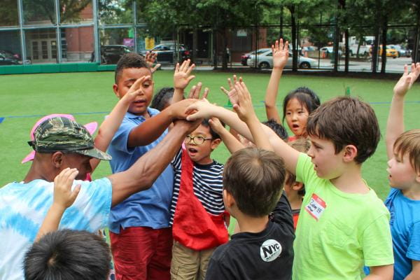 a group of people raising their hands