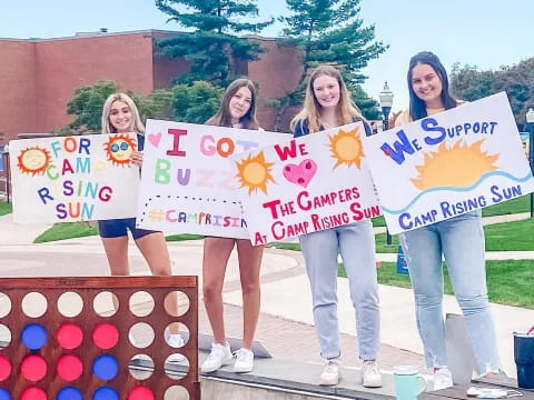 a group of women holding signs