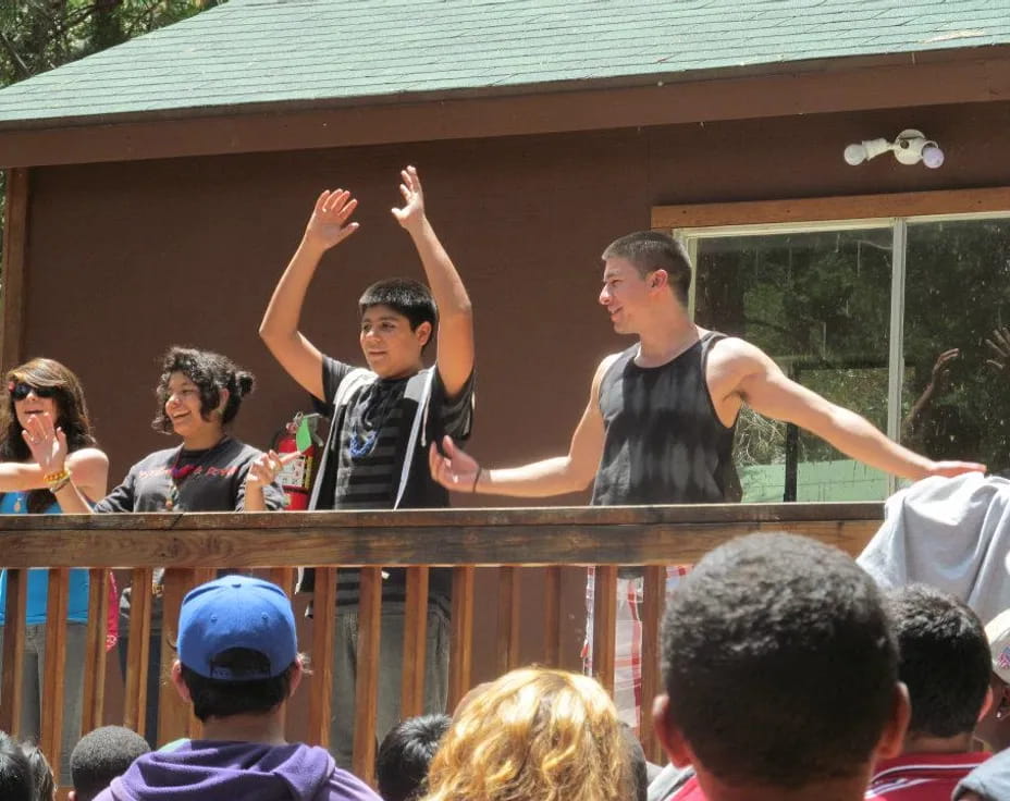 a group of people on a balcony