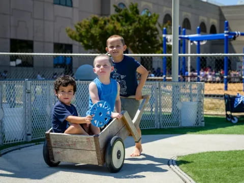 a group of kids on a wagon