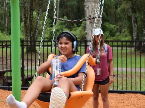 a woman sitting on a swing