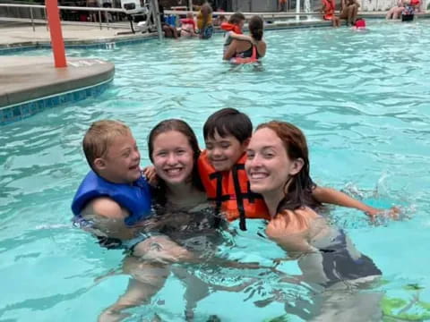 a group of people in a pool
