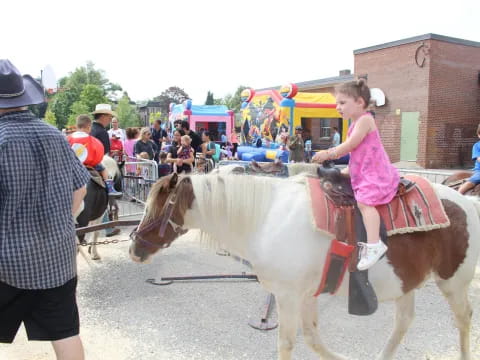 a girl riding a horse