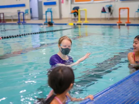 a group of women in a pool