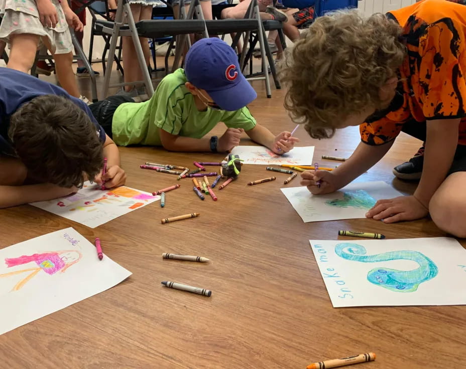 children drawing on paper