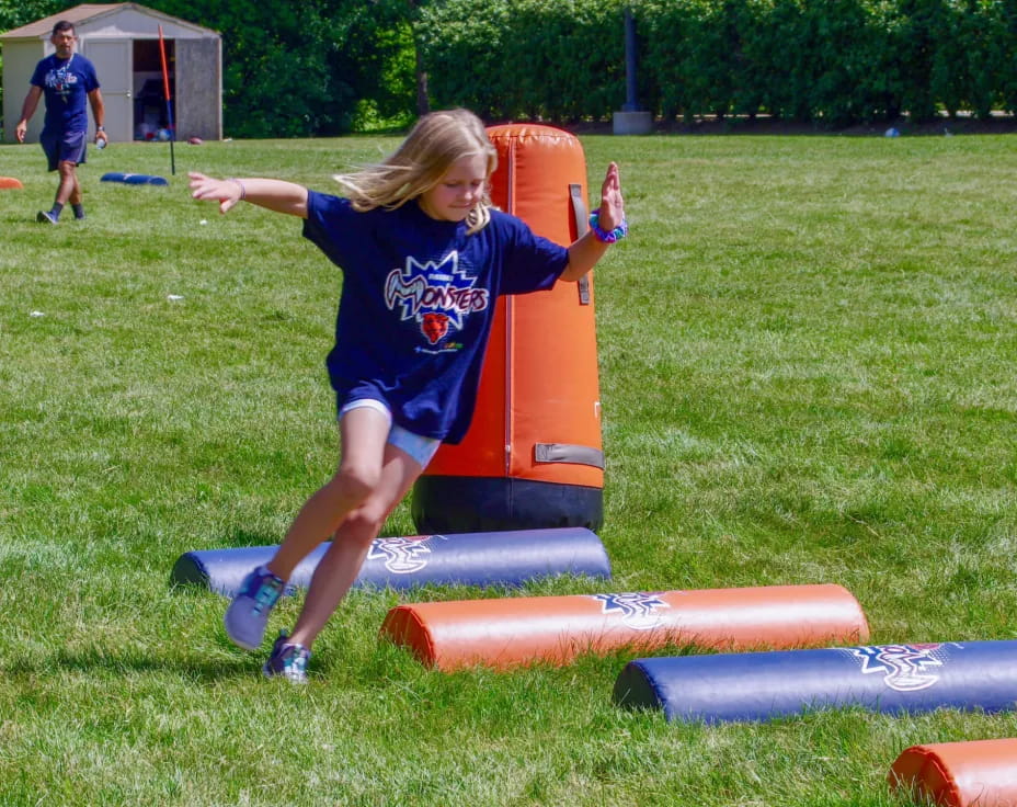 a girl playing on a playground