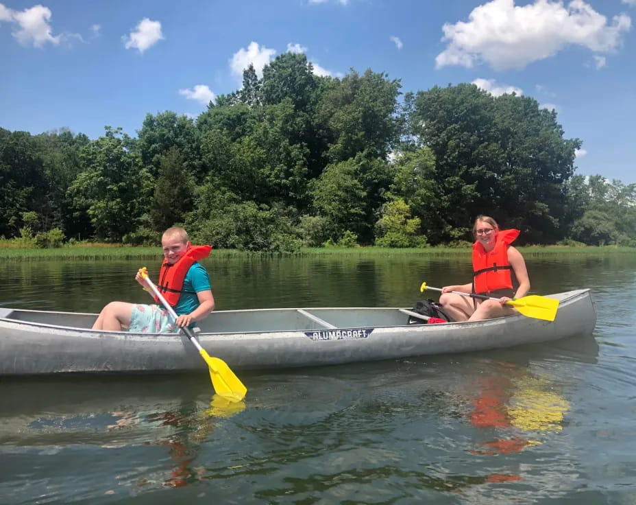 a couple of people in a canoe