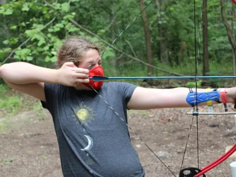 a person holding a bow and arrow
