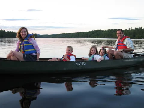 a group of people in a canoe