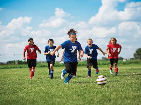 a group of kids playing football