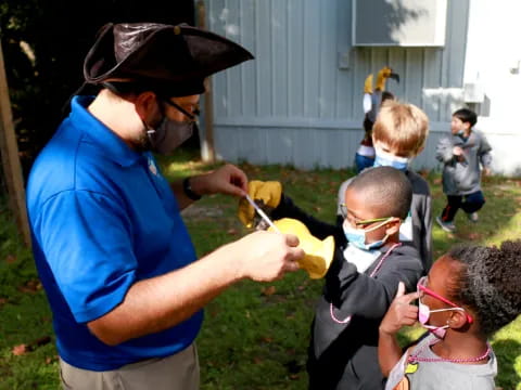 a person helping a kid with a toy