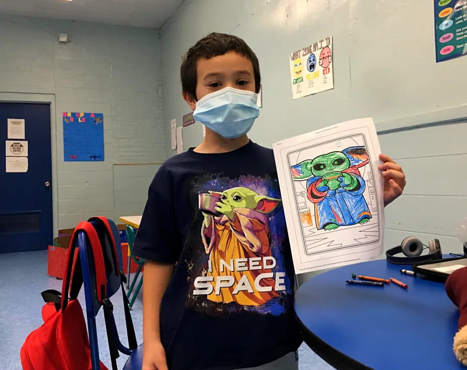 a boy holding a picture