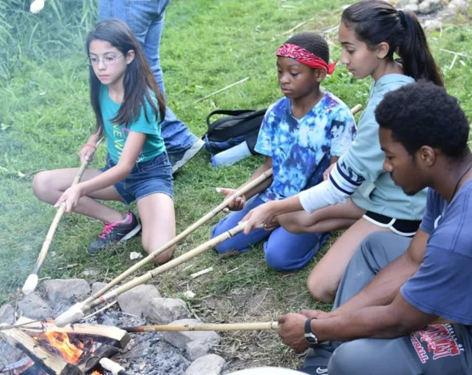 a group of people around a campfire